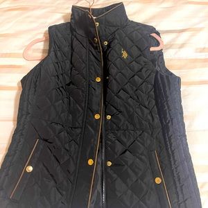 Black and gold vest